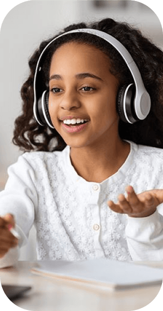 Student with headphones learning online